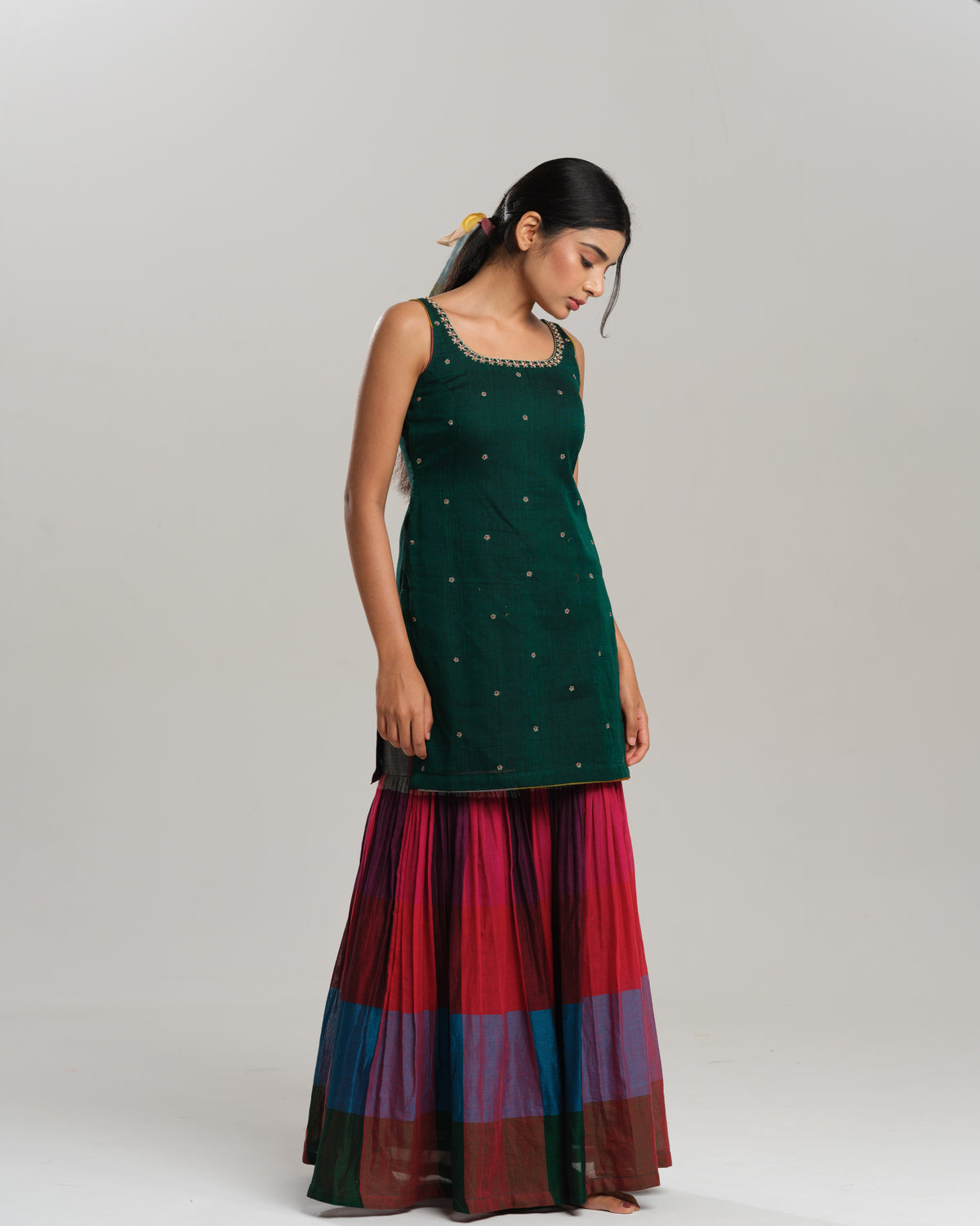 Model wearing a forest green embroidered kurta with pleated Narayanpet sharara—an elegant handloom co-ord set for women.