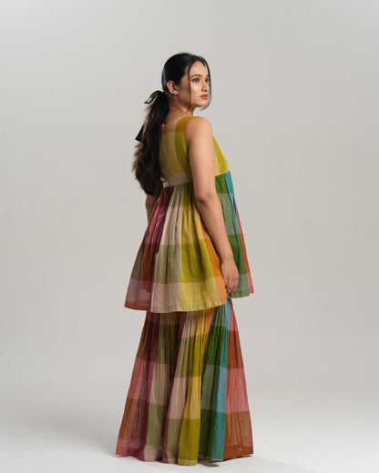 Model wearing a handwoven Narayanpet cotton sharara set in vibrant multicolour checks with embroidery detailing.