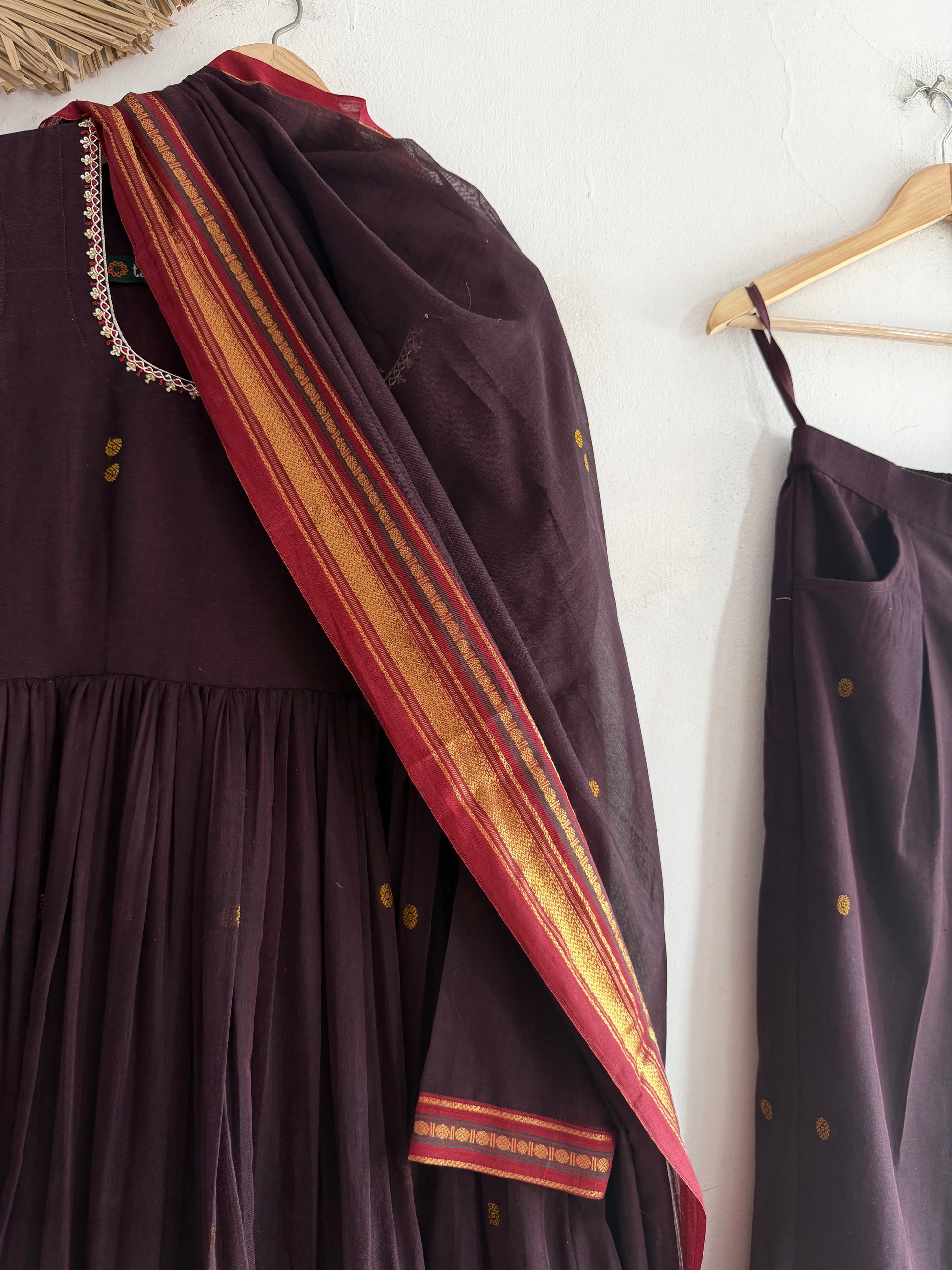 Maharani's Plum Kurtha Set – deep plum Narayanpet handloom kurtha with gold borders paired with matching bottoms and dupatta.