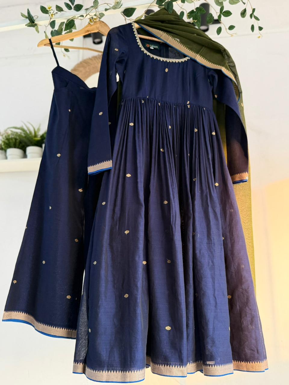 Midnight Blue Kurtha Set – deep navy handloom kurtha with subtle zari accents, matching bottoms, and coordinated dupatta displayed on hanger.