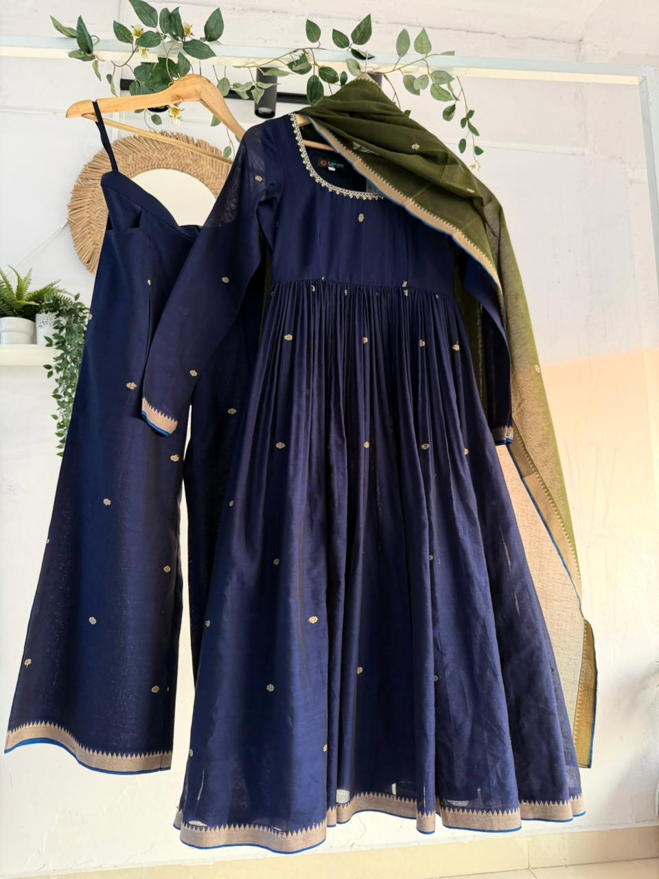 Midnight Blue Kurtha Set – deep navy handloom kurtha with subtle zari accents, matching bottoms, and coordinated dupatta displayed on hanger.