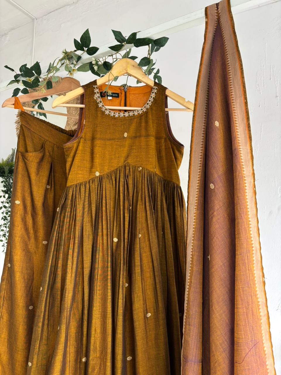Golden Blush Narayanpet Kurta Set featuring mustard kurta, flared sharara bottoms, and pastel peach dupatta.