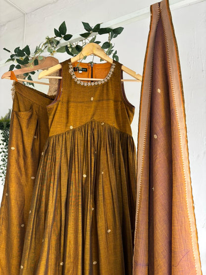 Golden Blush Narayanpet Kurta Set featuring mustard kurta, flared sharara bottoms, and pastel peach dupatta.