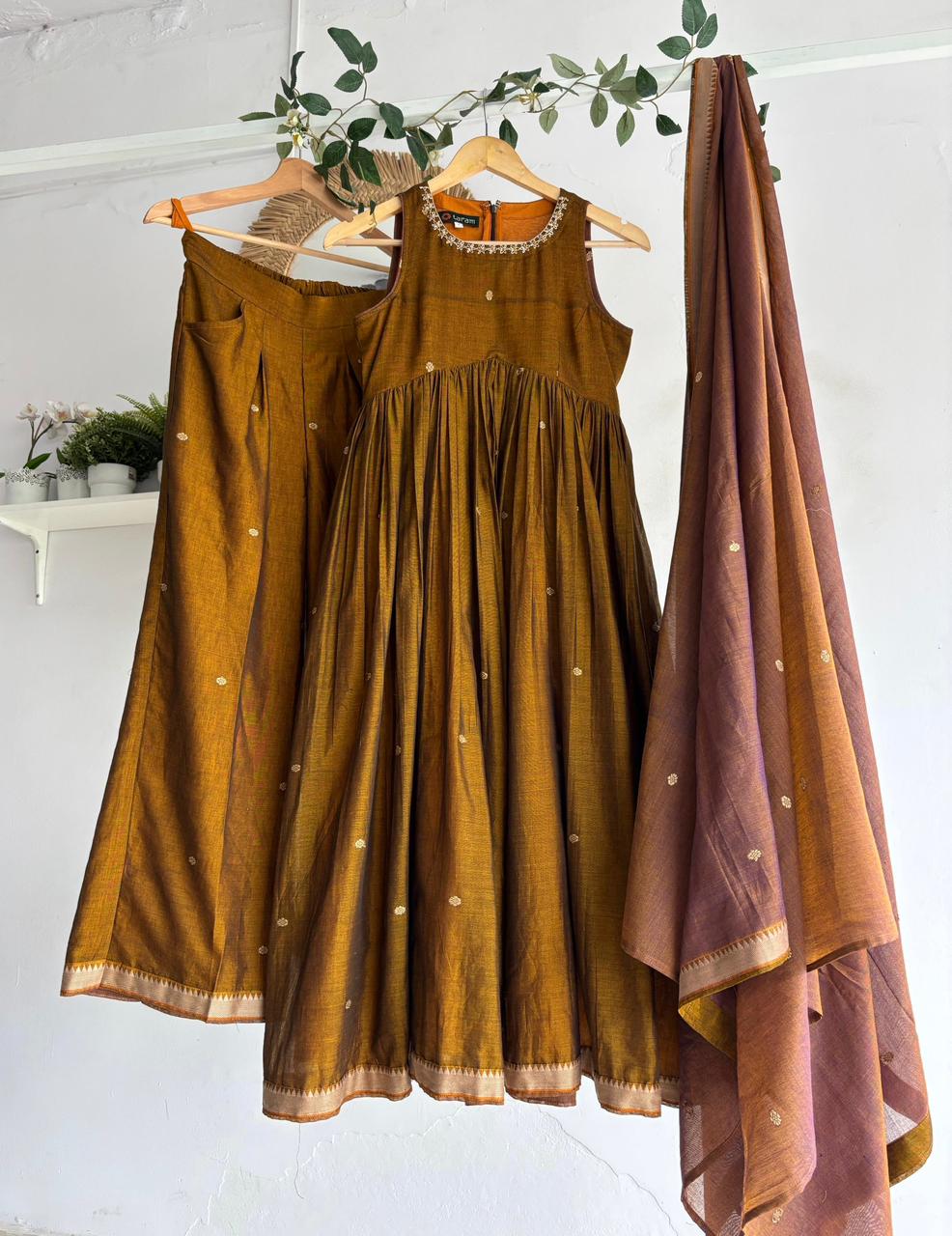 Golden Blush Narayanpet Kurta Set featuring mustard kurta, flared sharara bottoms, and pastel peach dupatta.