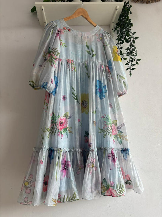 Pastel Meadow Mul Chanderi Multi Tiered Dress showcasing soft floral patterns and a comfortable tiered design.
