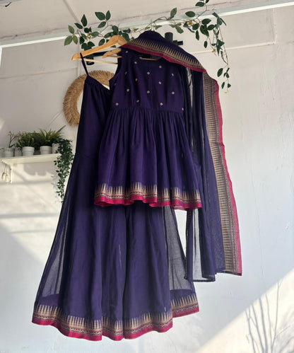 Purple Narayanpet Sharara Set – handloom purple kurta with gold motifs, flared sharara, and matching dupatta with zari border displayed on hanger.