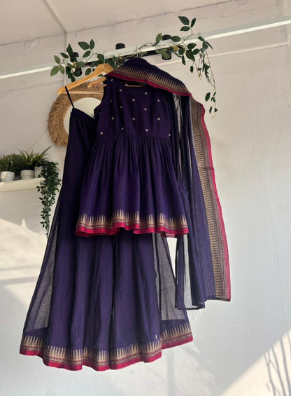 Purple Narayanpet Sharara Set – handloom purple kurta with gold motifs, flared sharara, and matching dupatta with zari border displayed on hanger.